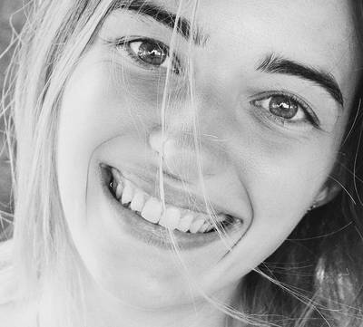 Bride with bright white smile after bridal teeth whitening at Carte Blanche